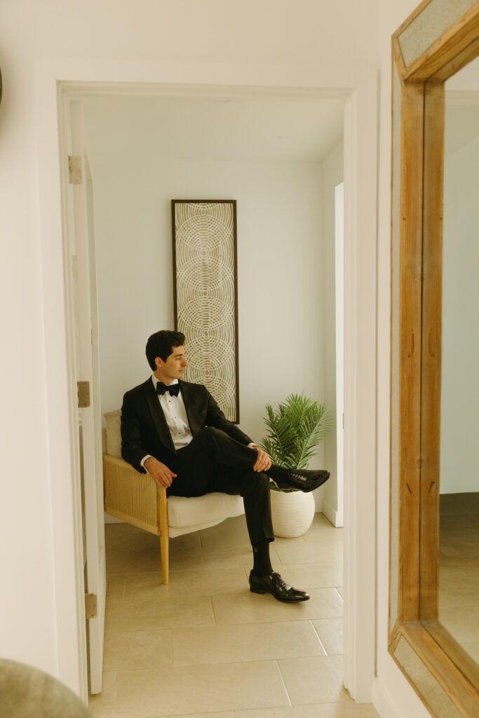 Groom getting ready in Arizona Airbnb