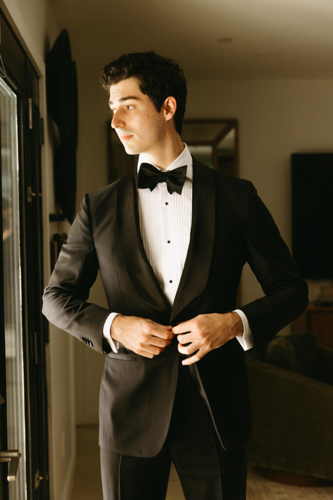 Groom getting ready in Arizona Airbnb