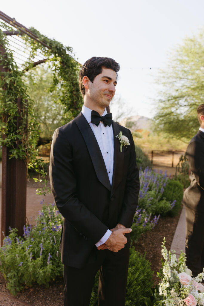 Bride walking down the aisle during a Desert Botanical Garden wedding ceremony