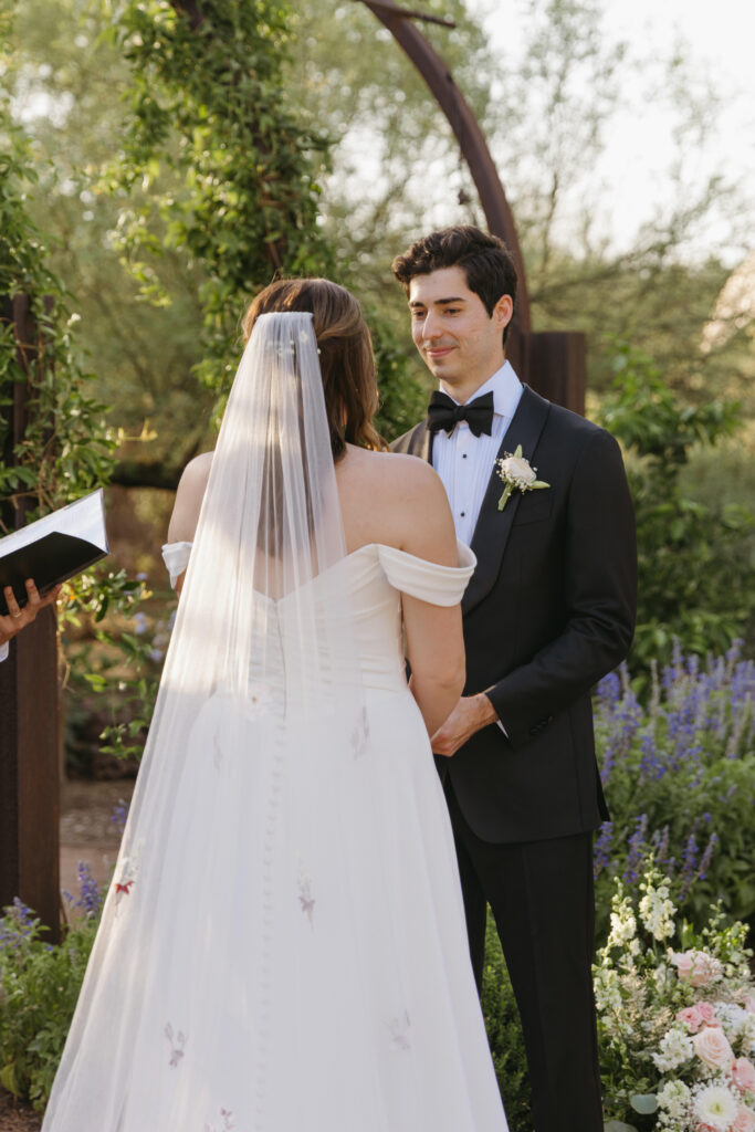 Couple exchanging vows beneath the Arizona desert sky at Desert Botanical Garden