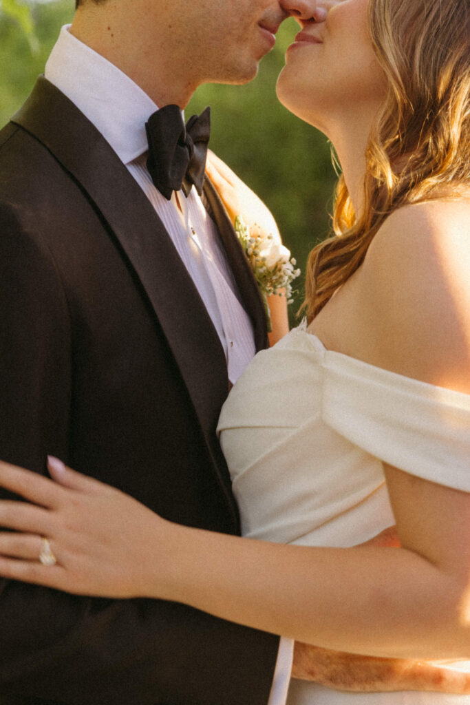 Couple embracing among desert blooms during their Desert Botanical Garden wedding