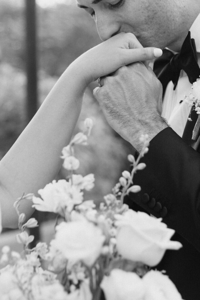 Couple embracing among desert blooms during their Desert Botanical Garden wedding