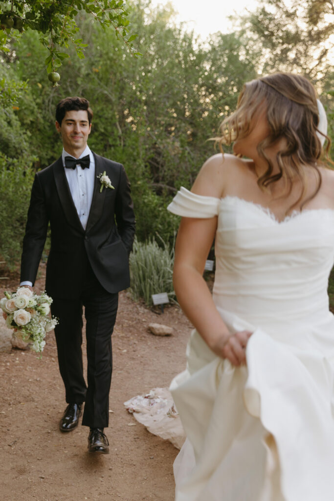 Newlyweds exploring the cactus gardens at Desert Botanical Garden after their ceremony