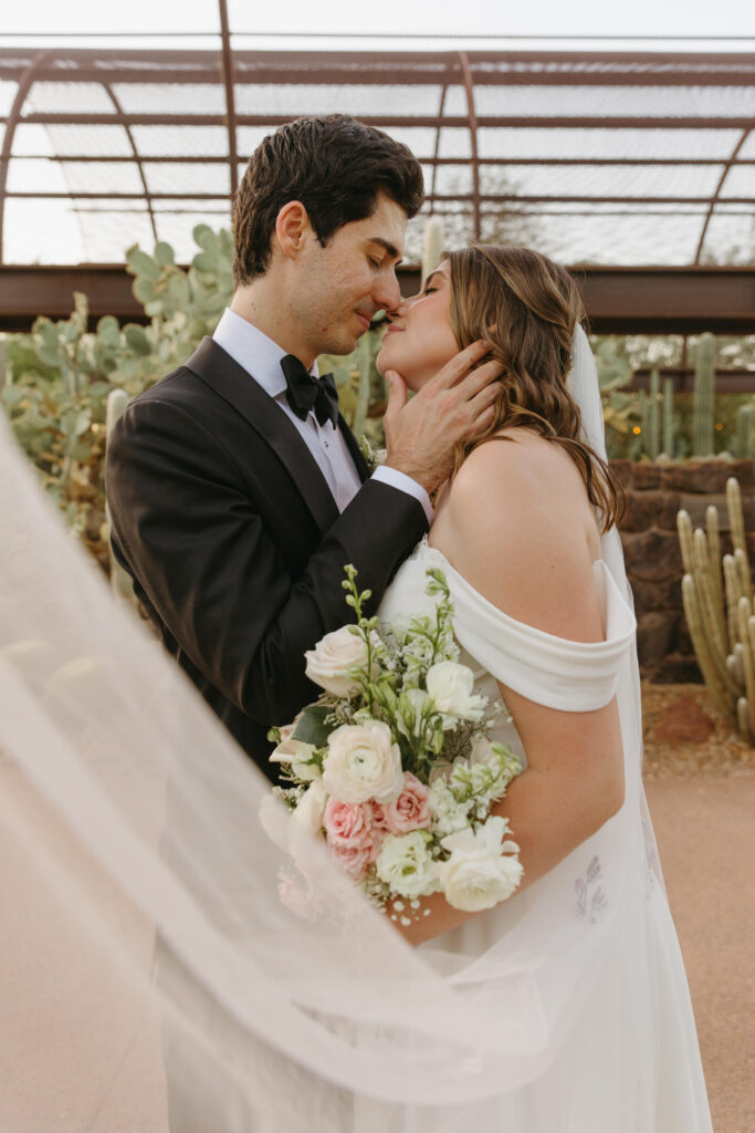 Newlyweds exploring the cactus gardens at Desert Botanical Garden after their ceremony