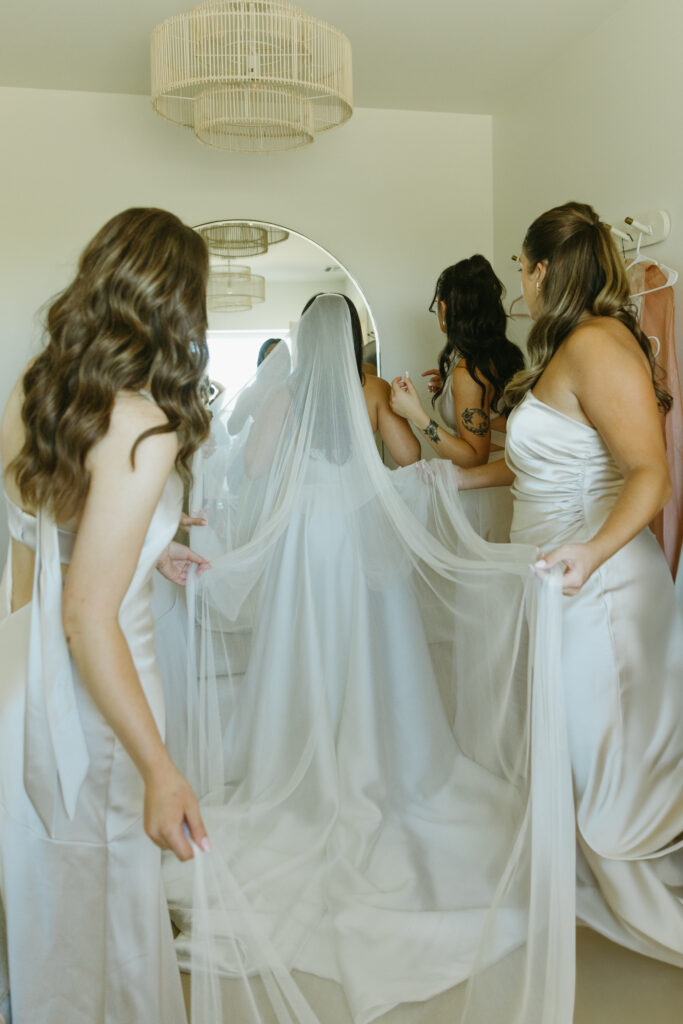 bride getting ready on wedding day at desert view wedding venue 