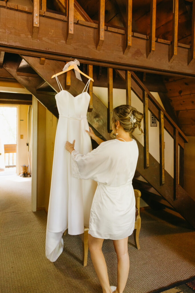 Bride getting ready inside cabin at Cabins on Strawberry Hill