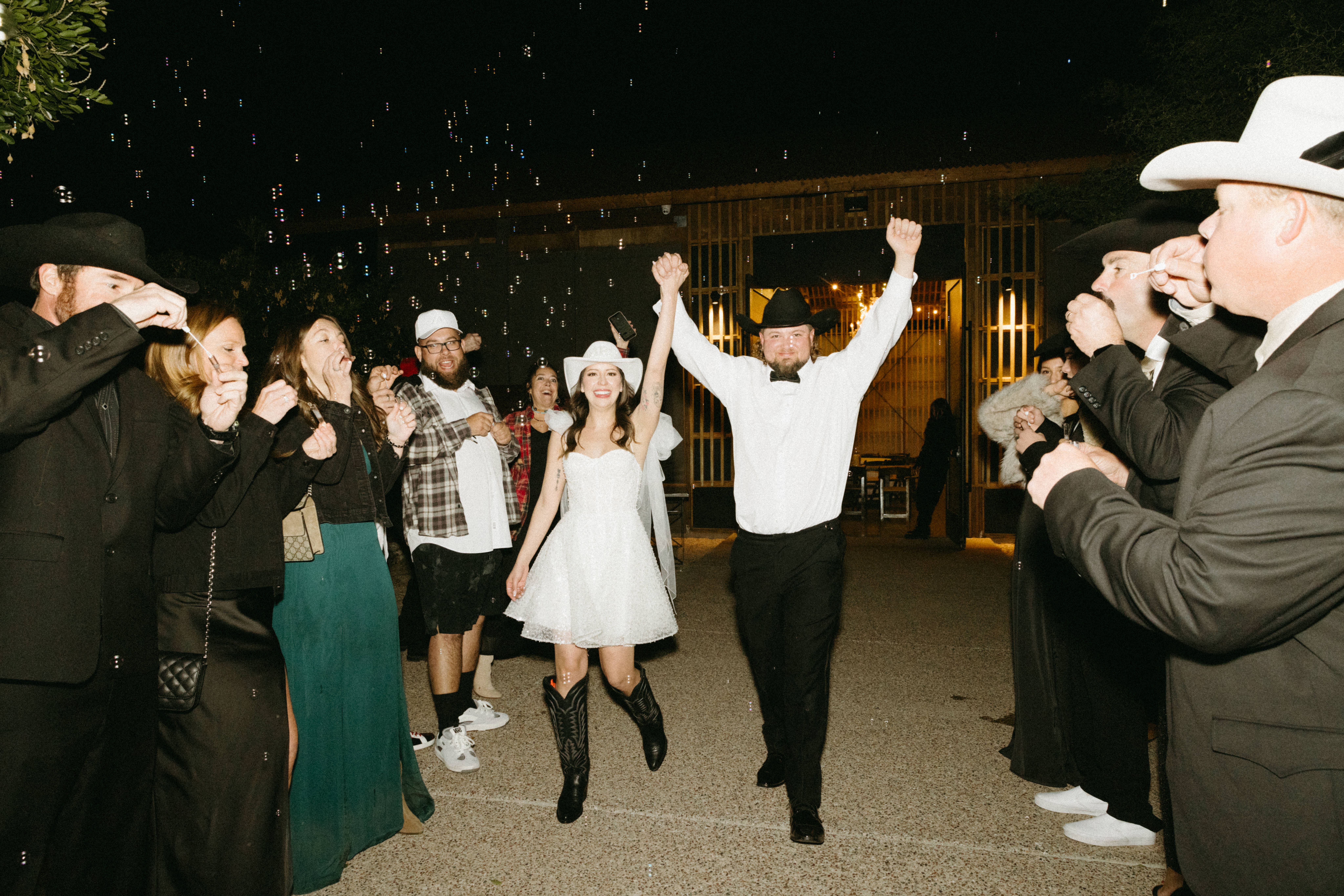 Bride and groom celebrating with family and friends at The Paseo.
