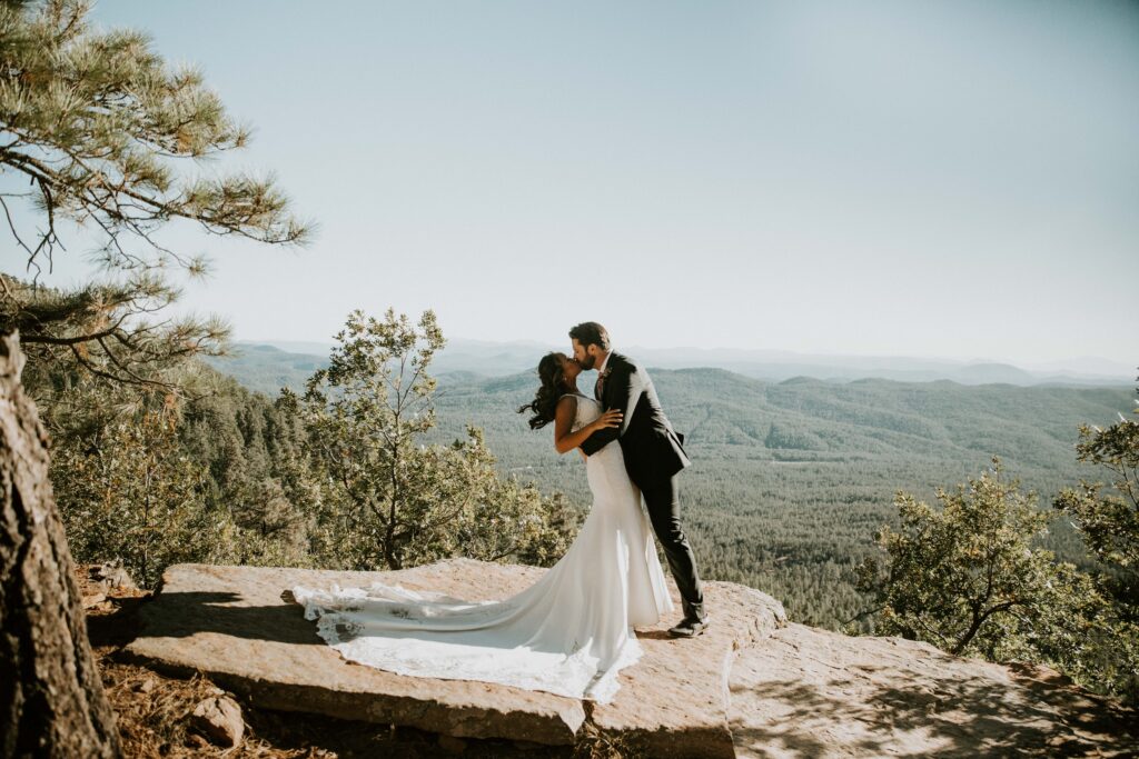 Couple sharing private vows during their Payson elopement at Mogollon Rim.