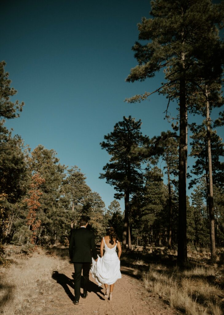 Couple sharing private vows during their Payson elopement at Mogollon Rim.