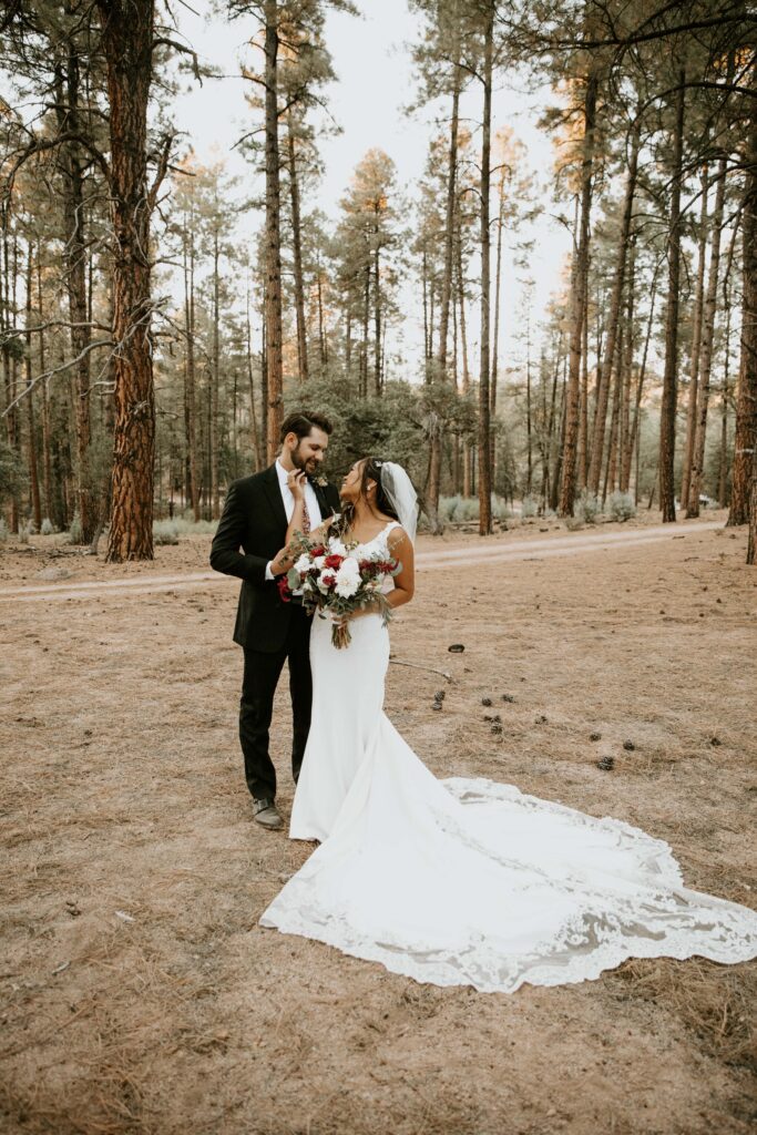 bride and groom portraits beneath the ponderosa pines in Payson, Arizona.