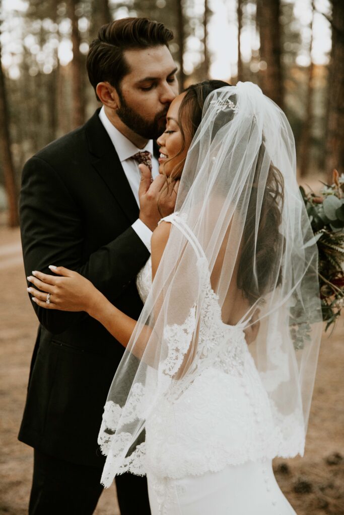 bride and groom portraits beneath the ponderosa pines in Payson, Arizona.