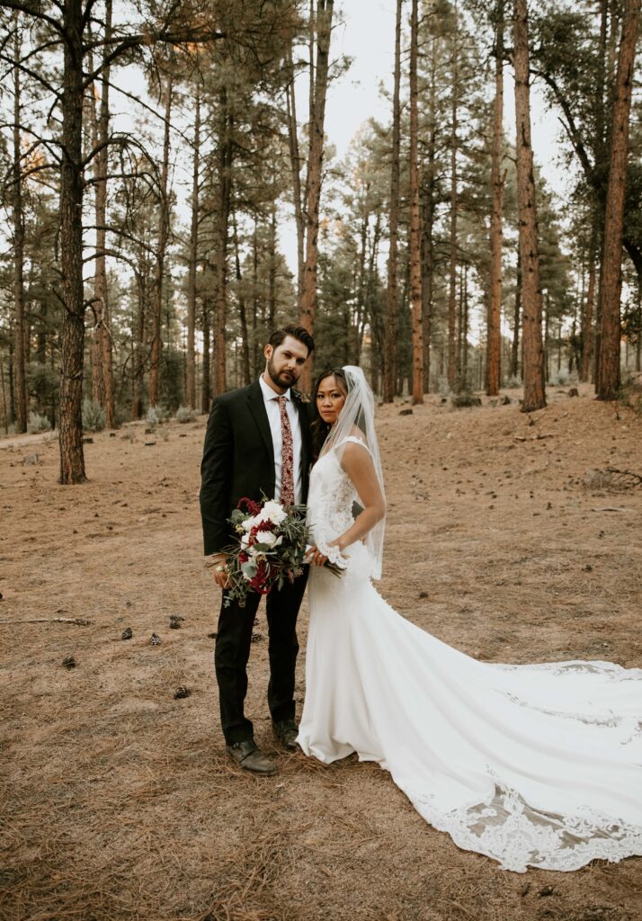 bride and groom portraits beneath the ponderosa pines in Payson, Arizona.