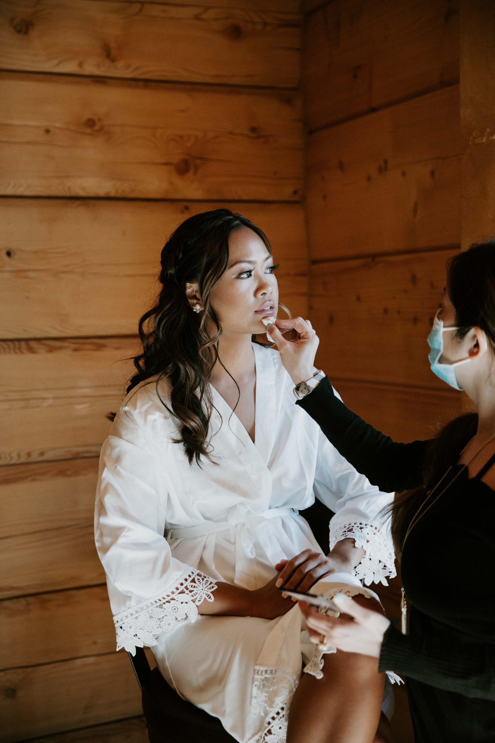 bride getting ready for Payson elopement in cabin