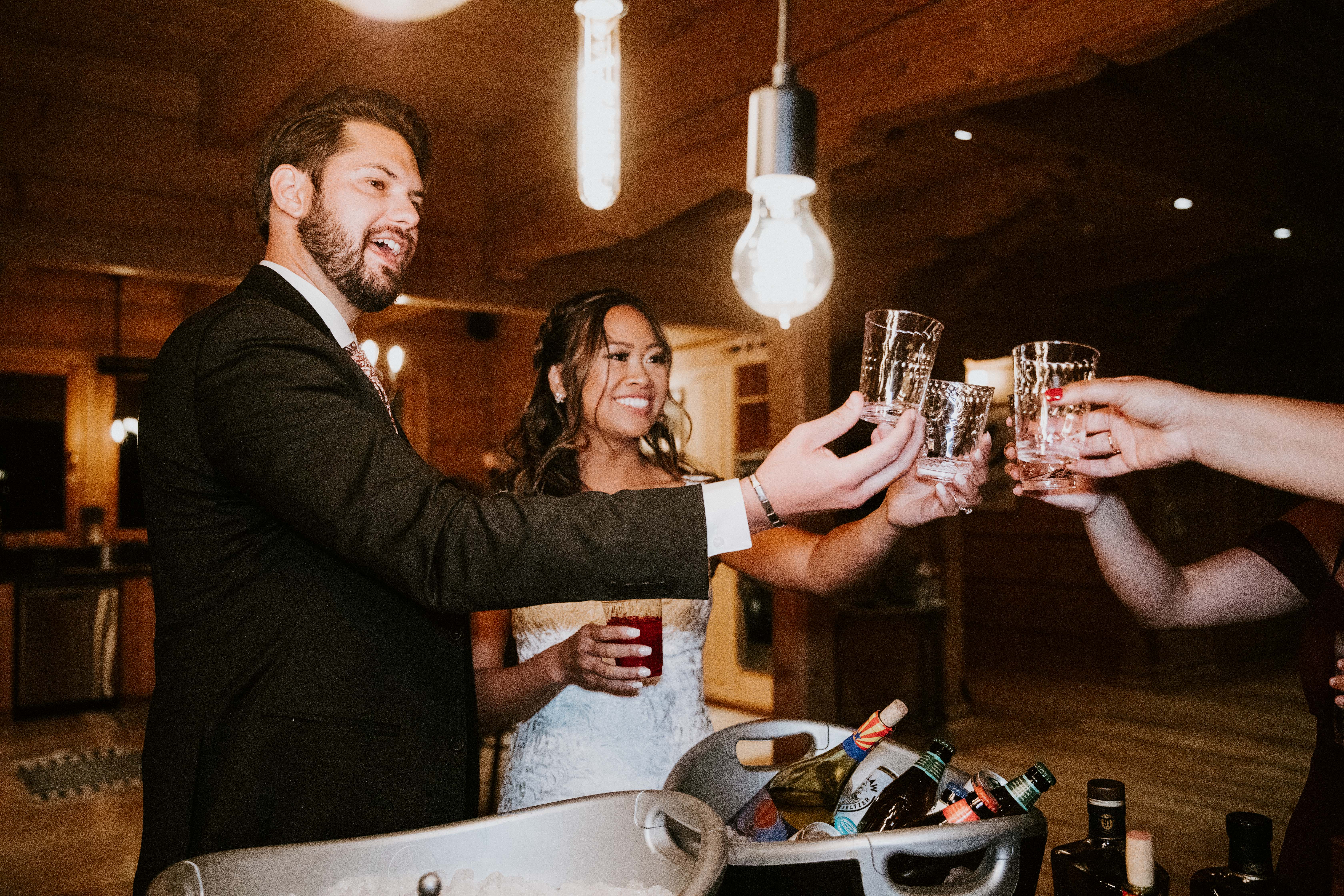 couple cheers during reception