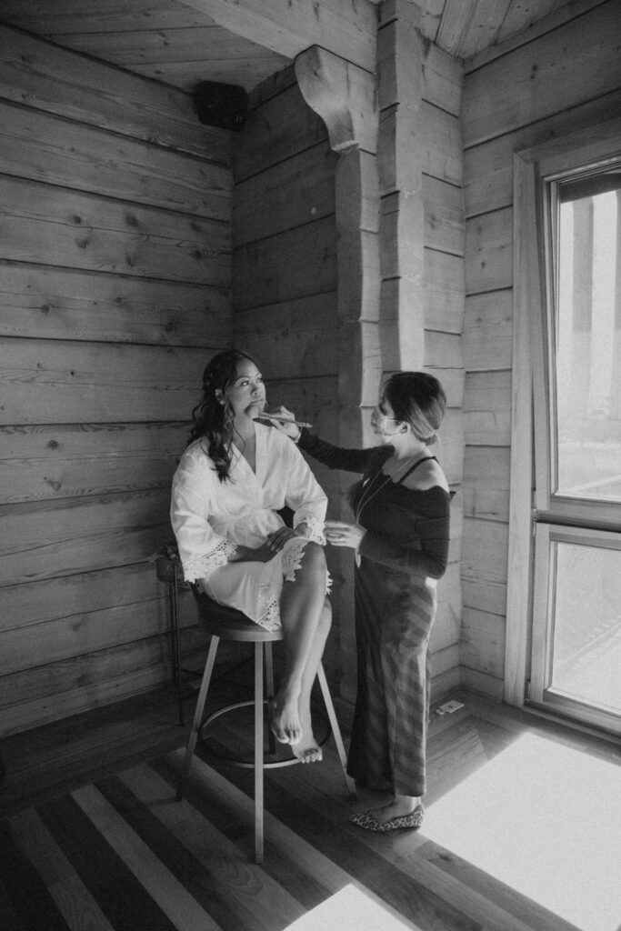 bride getting ready for Payson elopement in cabin