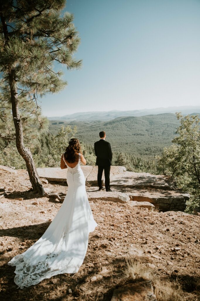 Couple sharing private vows during their Payson elopement at Mogollon Rim.