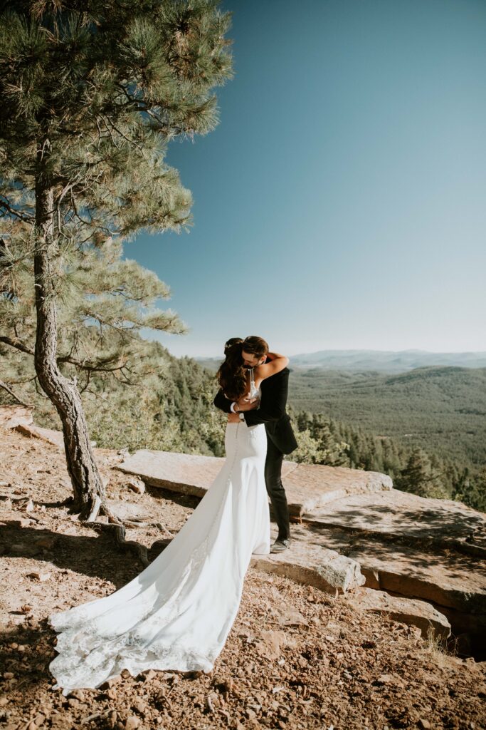 Couple sharing private vows during their Payson elopement at Mogollon Rim.
