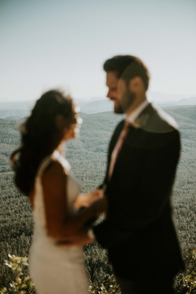 Couple sharing private vows during their Payson elopement at Mogollon Rim.