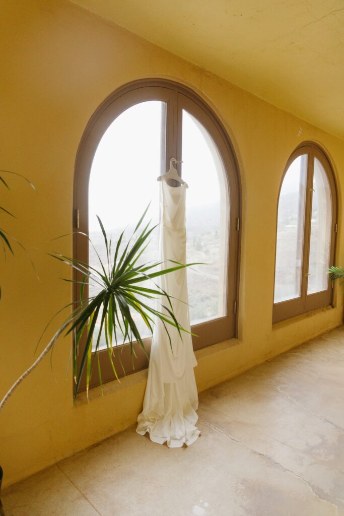 brides dress hanging at the little daisy venue