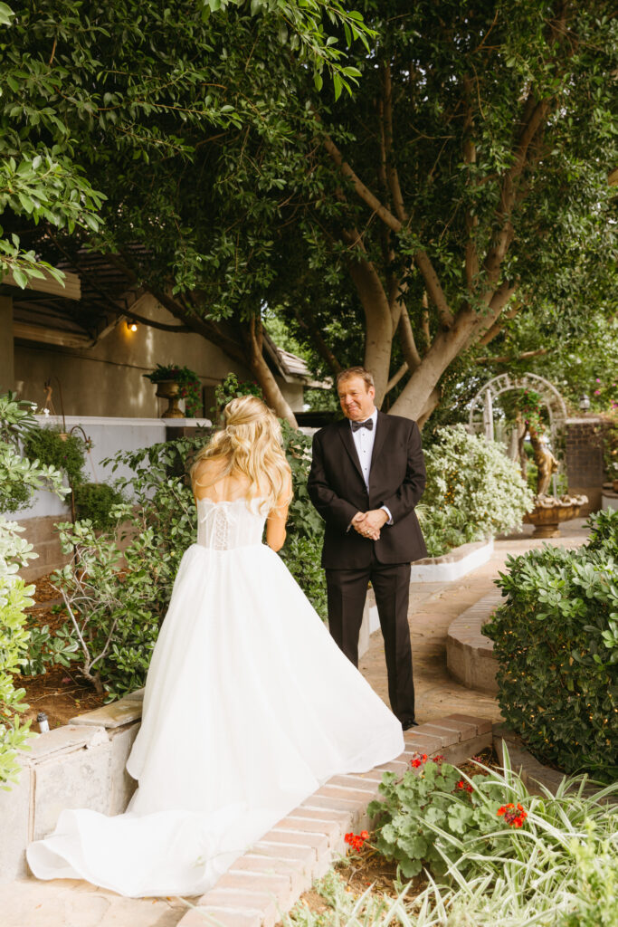 father and daughter first look at wedding