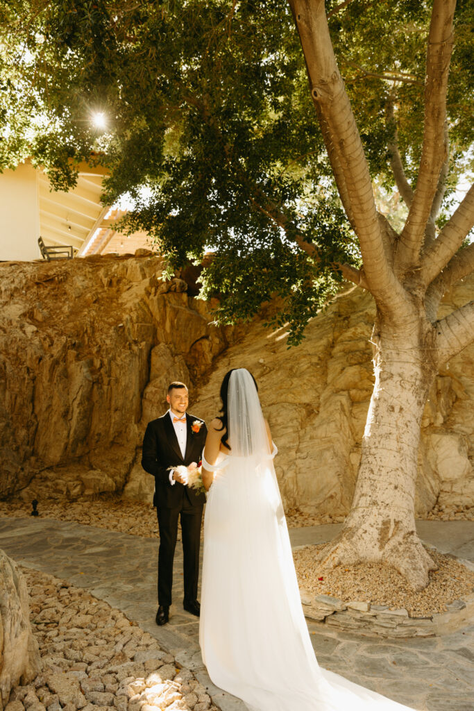 Bride and groom embracing after reading private vows at Different Pointe of View.